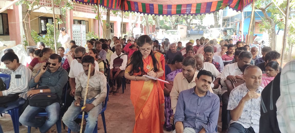 Monthly community meeting under the pandal at the centre
